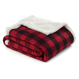 Red and black checkered blanket with a white sherpa lining, folded neatly.