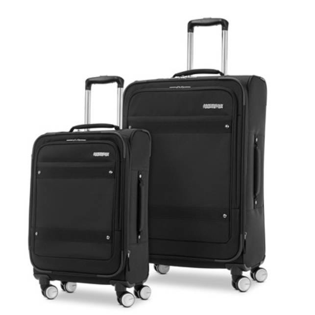 Two black suitcases with telescopic handles and wheels, one larger than the other.