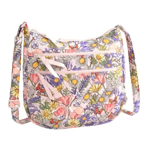 A shoulder bag featuring a vibrant floral pattern with daisies, poppies, and various flowers in pink, yellow, and purple hues. It includes adjustable straps and multiple zippered compartments.