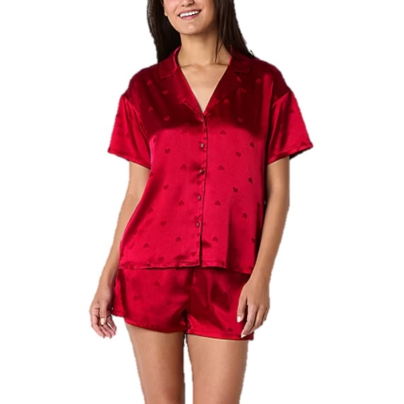 A red satin 2-piece pajama set consisting of a short-sleeved button-up top with a collar and matching shorts, both featuring a subtle heart pattern.