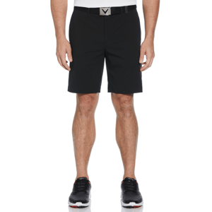 A person is wearing black shorts with a belt and black athletic shoes.