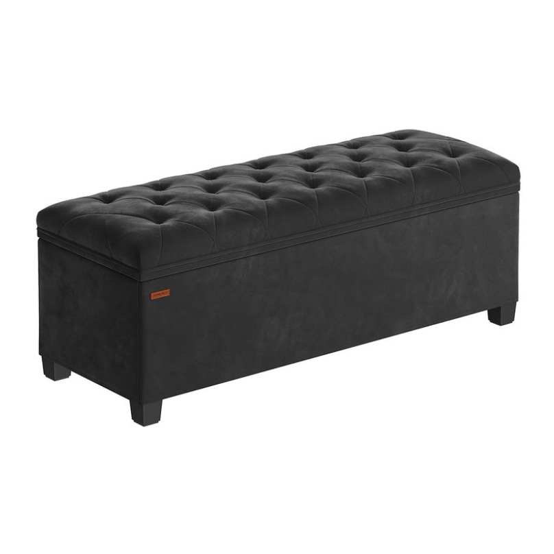 A rectangular storage ottoman upholstered in black tufted faux-leather with raised wooden legs, offering a combination of seating and storage solution.
