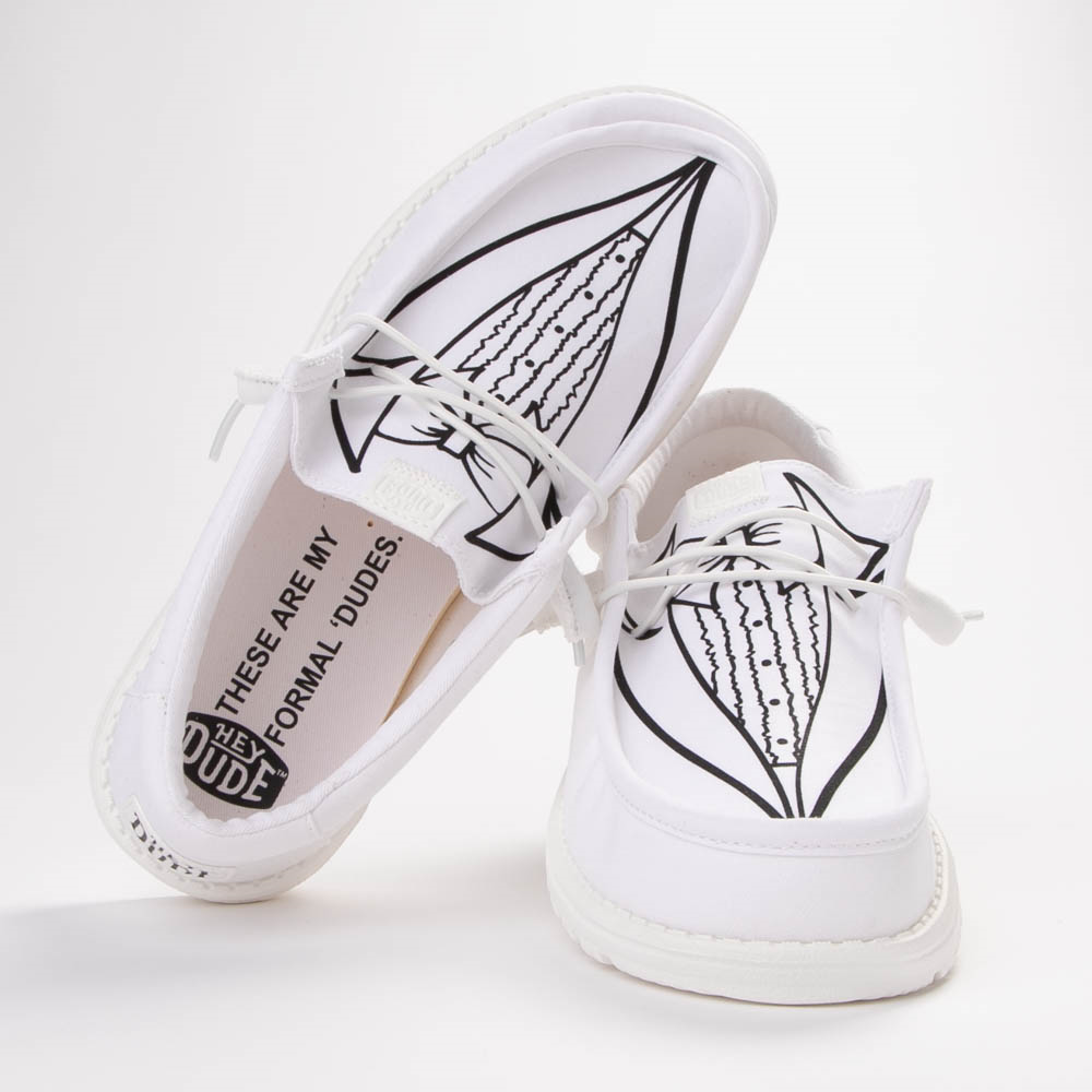 A pair of white casual lace-up shoes with a tuxedo print on the top.