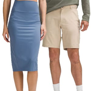 A woman is wearing a blue pencil skirt, while a man stands beside her wearing beige shorts and a long-sleeve shirt.