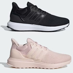 Two pairs of athletic shoes, one black and one pink.