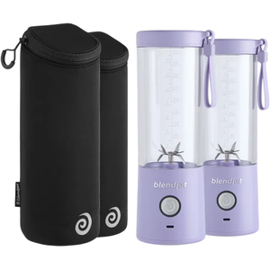 Two portable blenders in lavender color with measuring markings and carrying loops, paired with two black cylindrical travel cases.