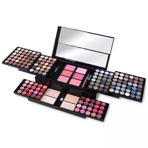 The Macy's Essential Makeup Kit features a variety of cosmetics, including eyeshadows, blushes, lip colors, highlighters, and mirrors, all organized in a sleek black case with slide-out compartments for easy access.