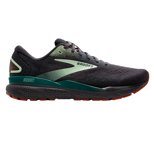 Brooks running shoe in black with green accents, labeled \“Ghost,\“ featuring a cushioned sole and sturdy tread for support and grip.