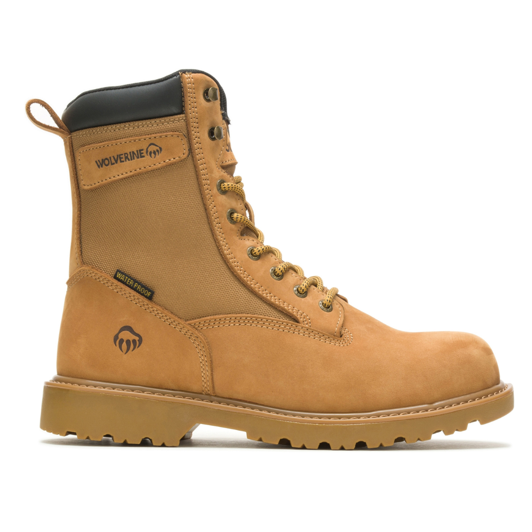 A tan, high-top, waterproof work boot with a rugged rubber sole, reinforced toe, and lace-up design, featuring the Wolverine logo.