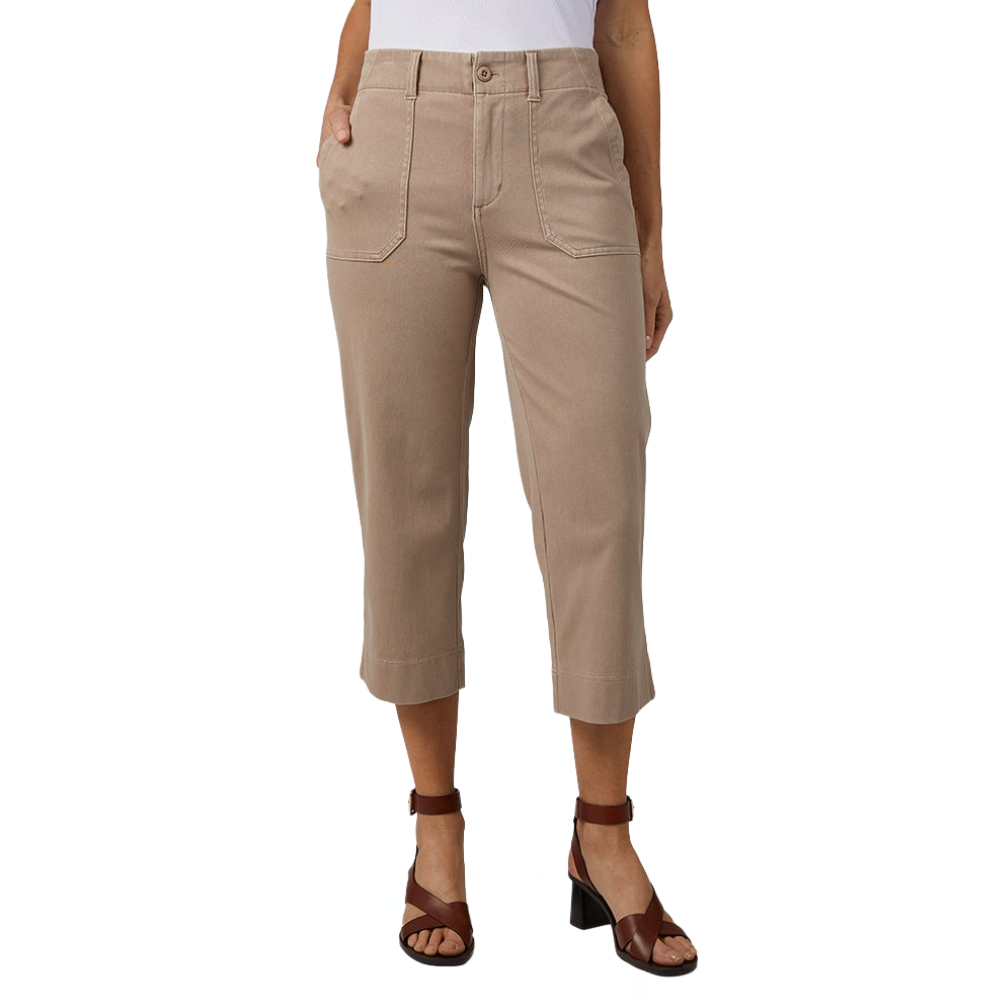 A person is wearing beige cropped pants with front pockets and a white top, paired with brown heeled sandals.