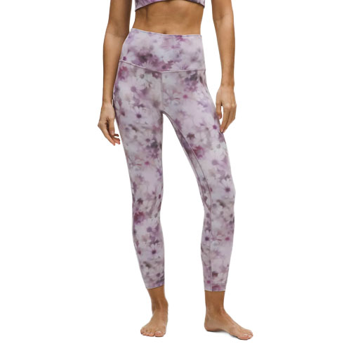 Model wearing high-waisted, purple and white tie-dye leggings.
