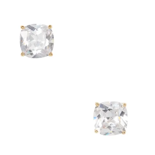 A pair of cushion-cut diamond stud earrings set in four-prong gold settings.