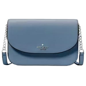 A blue Kate Spade leather crossbody bag features a structured shape, a flap closure with the brand's logo, and a chain strap with leather detailing.