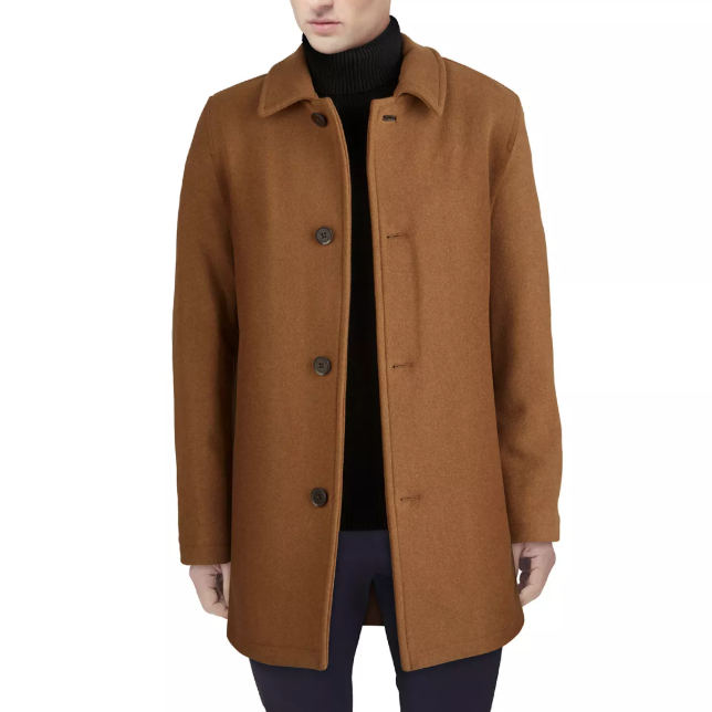 Brown wool coat with a button-up design, worn over a black turtleneck sweater.