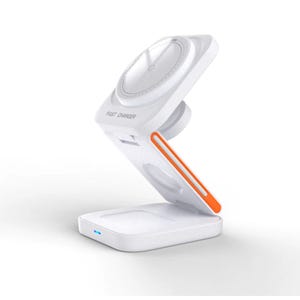 A white foldable wireless charger with an adjustable angle stand and a round charging pad, accented with an orange strip.