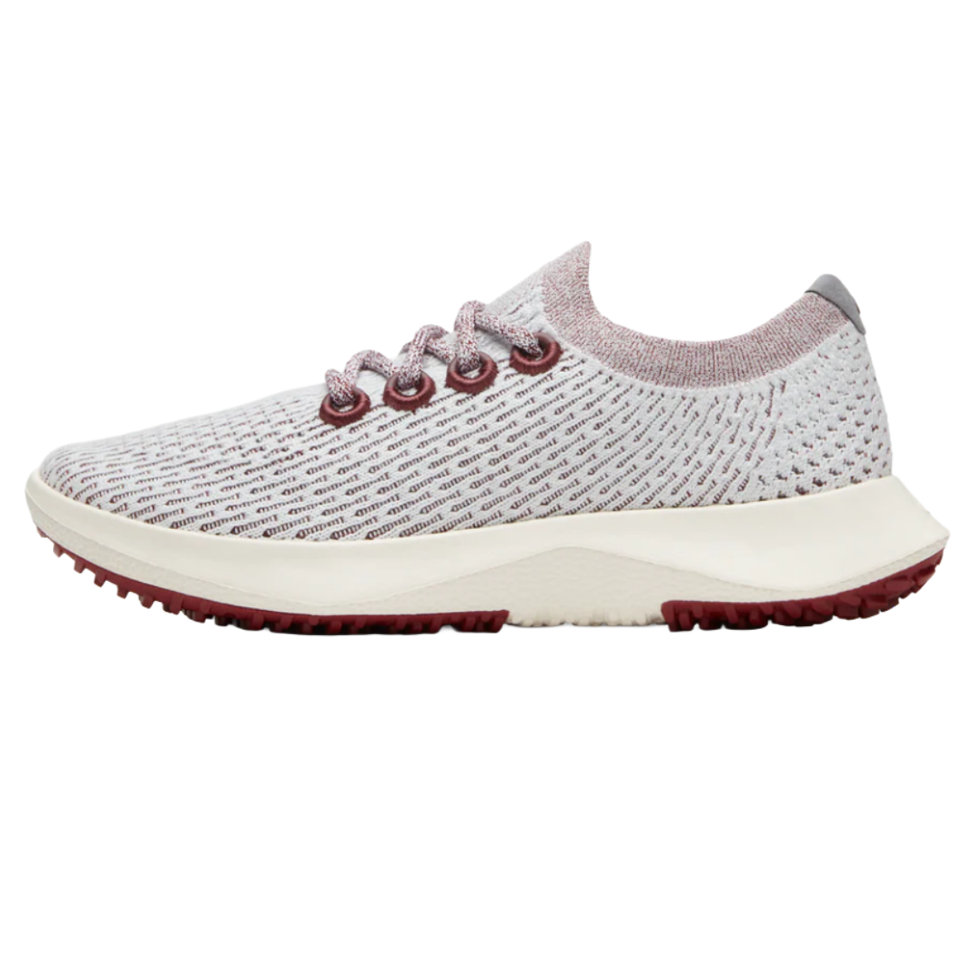 Sneaker with a textured, breathable knit upper in white and maroon, featuring maroon eyelets and a thick, cushioned white sole with maroon tread.