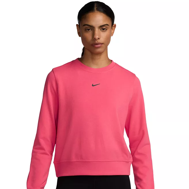 A pink Nike Dri-Fit French Terry Sweatshirt featuring a crew neck and a small Nike swoosh logo on the front. The design is simple and athletic, providing comfort and a stylish look.