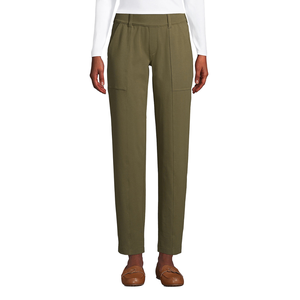 Olive green trousers with front seams and side pockets paired with brown loafers.
