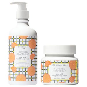 Beekman 1802 Honeyed Grapefruit set includes a 12.5 fl oz goat milk hand and body wash and an 8 fl oz whipped body cream, featuring a citrus and honeycomb design.