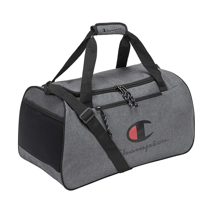 A gray Champion duffel bag with black straps and a large front logo, featuring a zippered main compartment and a detachable shoulder strap.