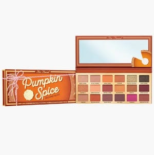 This is the Too Faced Pumpkin Spice eyeshadow palette, featuring an array of 18 shades with both matte and shimmer finishes, presented in a rectangular package with a mirror.