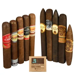 A selection of La Aurora and Oliva cigars arranged vertically, accompanied by a Boveda 2-way humidity control packet.