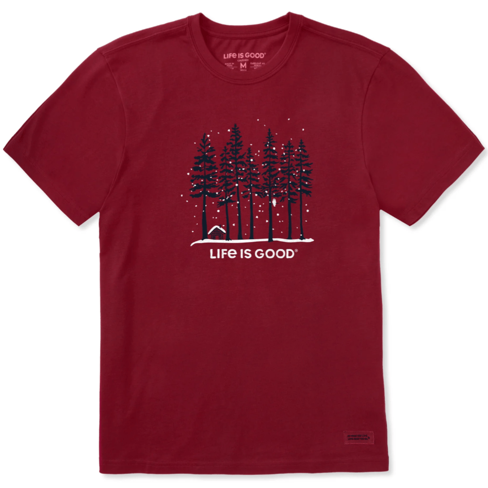 Red T-shirt with a graphic of snowy trees and a small cabin, featuring the text \“Life is Good\“ below the design.