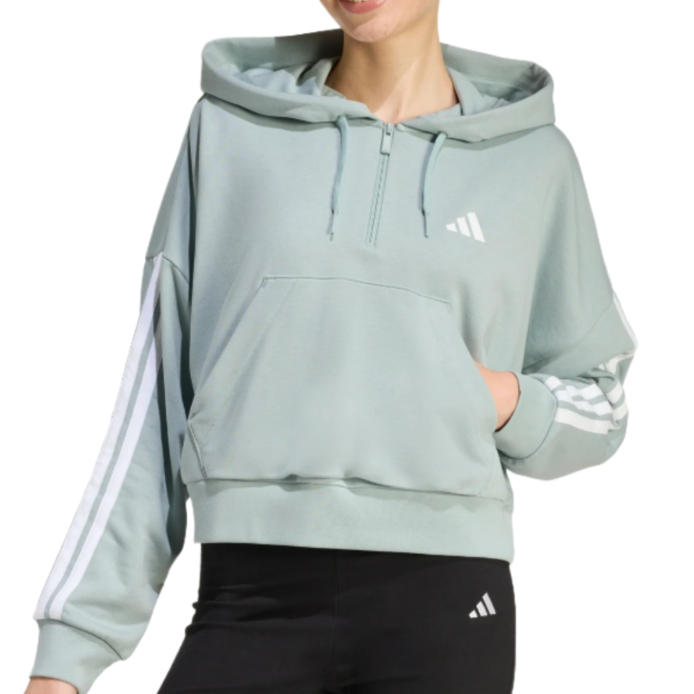 A light green Adidas hoodie with a hood, drawstrings, and white stripes down the sleeves. It features a kangaroo pocket and a small Adidas logo on the chest, paired with black leggings displaying the same logo.