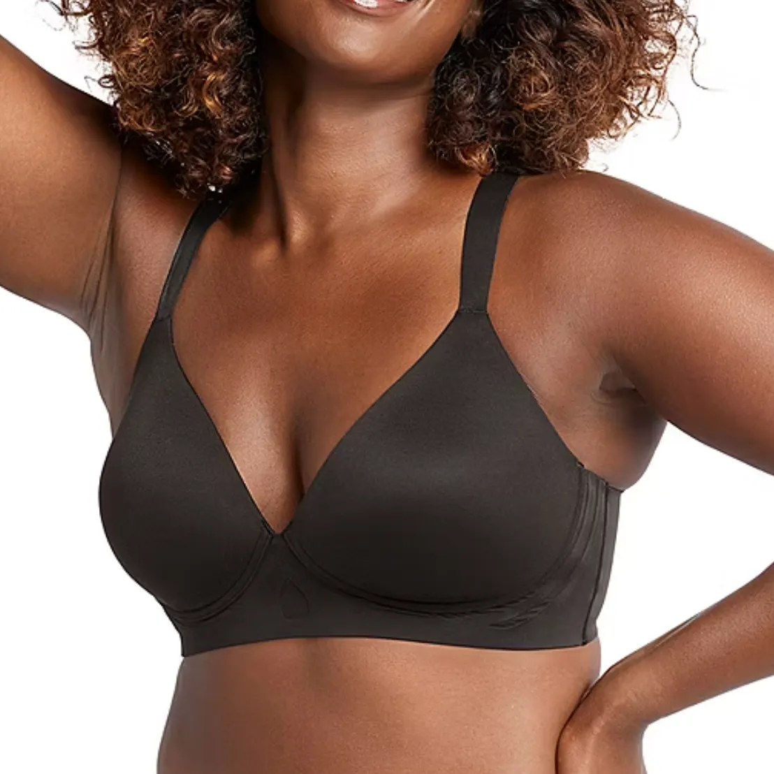 A woman is wearing a black Bali Comfort Wireless Bra, featuring smooth, seamless cups and adjustable straps for support and comfort.
