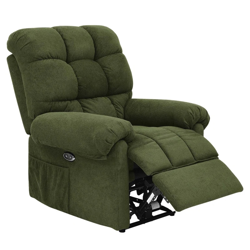 A green, plush, overstuffed power recliner with a padded back, seat, and armrests featuring a side pocket and a footrest extended.