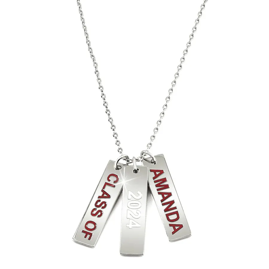 A silver necklace features three rectangular pendants inscribed with \“CLASS OF,\“ \“2024,\“ and \“AMANDA\“ in red lettering.