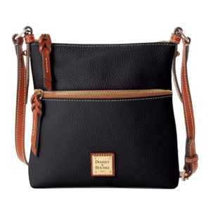 A black crossbody bag with brown leather straps and a front zipper, featuring a Dooney & Bourke logo patch.