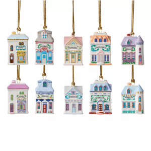 Hanging ceramic ornaments shaped like small, colorful shops, each labeled with a different herb or spice name: basil, nutmeg, paprika, cinnamon, oregano, thyme, ginger, rosemary, garlic, and parsley.