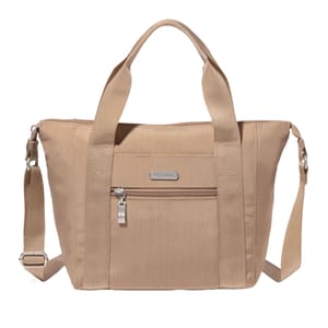 A beige Baggallini 12\“ tote with dual handles, an adjustable shoulder strap, and a front zip pocket. It features a rectangular shape and a metal logo plate.