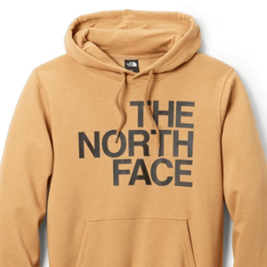 A tan hoodie with the grey logo of The North Face displayed on the front.