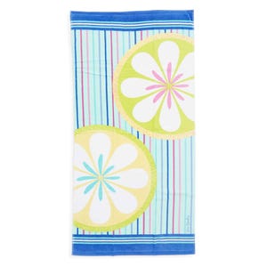 A beach towel with vibrant patterns featuring lime green and yellow circular floral designs on a colorful striped background in blue, pink, and green hues.