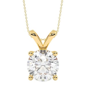A gold chain necklace featuring a solitaire round-cut diamond set in a four-prong setting.