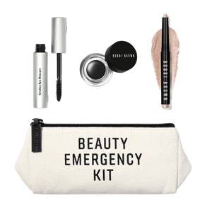 Beauty Emergency Kit containing Smokey Eye Mascara, black gel eyeliner in a pot, and a shimmery eyeshadow stick, all inside a zippered pouch.