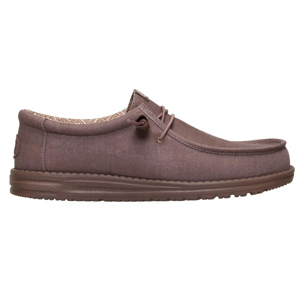 A brown casual slip-on shoe with moccasin-style stitching, featuring a textured sole and a simple lace design.