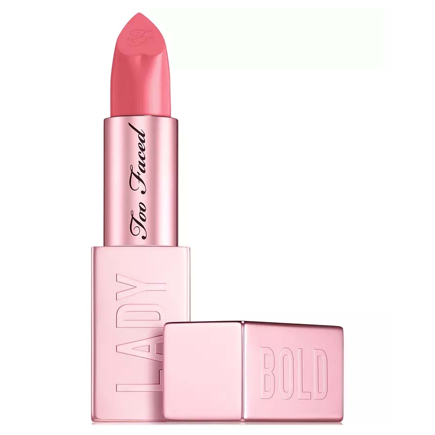 A pink lipstick from Too Faced, featuring a design with \“LADY\“ and \“BOLD\“ embossed on the case in a metallic finish.