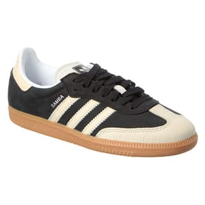 Adidas Samba sneaker with a black and cream leather upper, featuring white stripes and a gum sole.