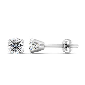 Classic round-cut diamond studs set in white gold with a four-prong setting, featuring a butterfly push-back closure.
