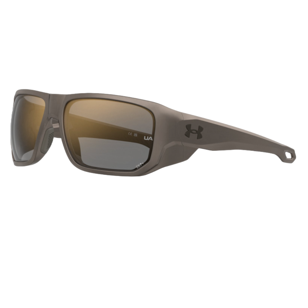 Under Armour Attack 2 Sunglasses feature a robust design with a brown frame and polarized lenses. The UA logo is visible on the temples, and the sunglasses offer full coverage for outdoor activities.