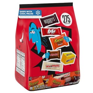 A large red bag labeled \“275 pieces\“ contains assorted Hershey's candy, including Kit Kat, Reese's, Rolo, Whoppers, and Milk Duds.