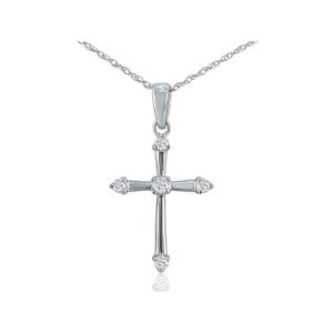 A silver cross pendant necklace with cubic zirconia accents, featuring a fine chain and simple bail design.