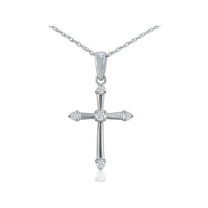 A silver cross pendant necklace with cubic zirconia accents, featuring a fine chain and simple bail design.