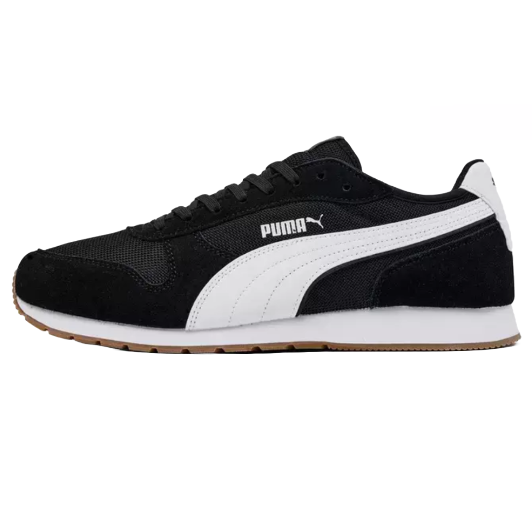 Black low-top sneakers with a white Puma logo and stripe, featuring a rubber outsole and mesh upper for casual wear.