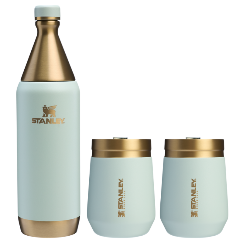 The Stanley Holiday Wine Set includes an insulated wine bottle and two insulated wine tumblers, all in a sleek design with a light blue finish and gold accents.