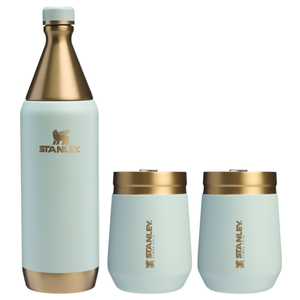 The Stanley Holiday Wine Set includes an insulated wine bottle and two insulated wine tumblers, all in a sleek design with a light blue finish and gold accents.
