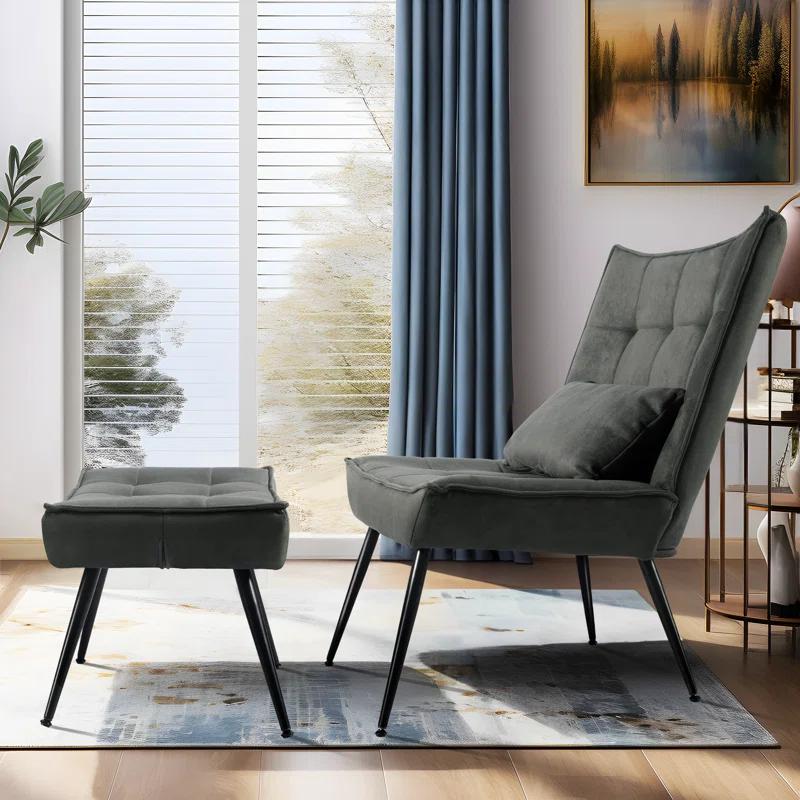 A gray upholstered lounge chair with black metal legs and a matching ottoman.